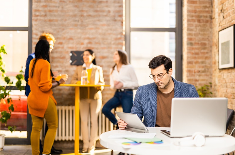 Project managers and employees brainstorming on ideas - Multi-ethnic group of workers having business meeting in a start-up office